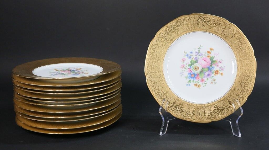 Appraisal: Hutschenreuther gilt rimmed dinner plates with transfer floral decoration All