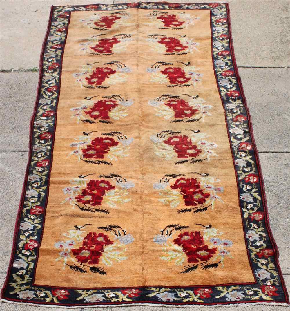 Appraisal: FLORAL KAZAK RUNNER in red gray blue green black red