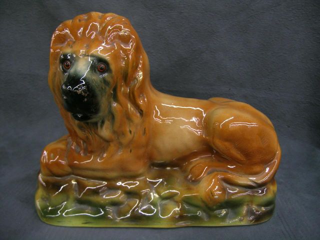 Appraisal: Large Staffordshire recumbent lion with glass eyes circa