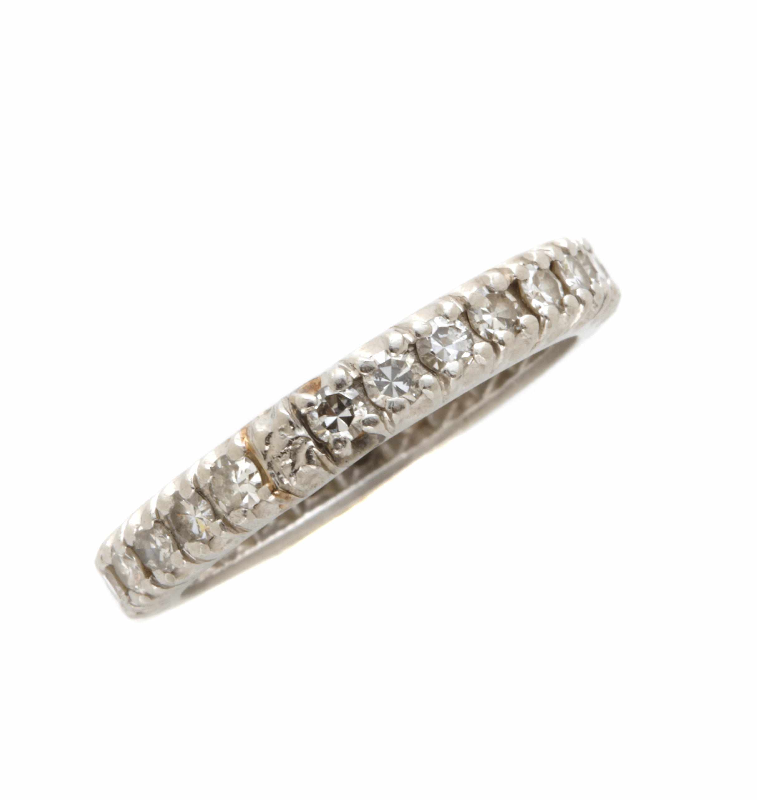 Appraisal: A diamond and platinum eternity band estimated total diamond weight