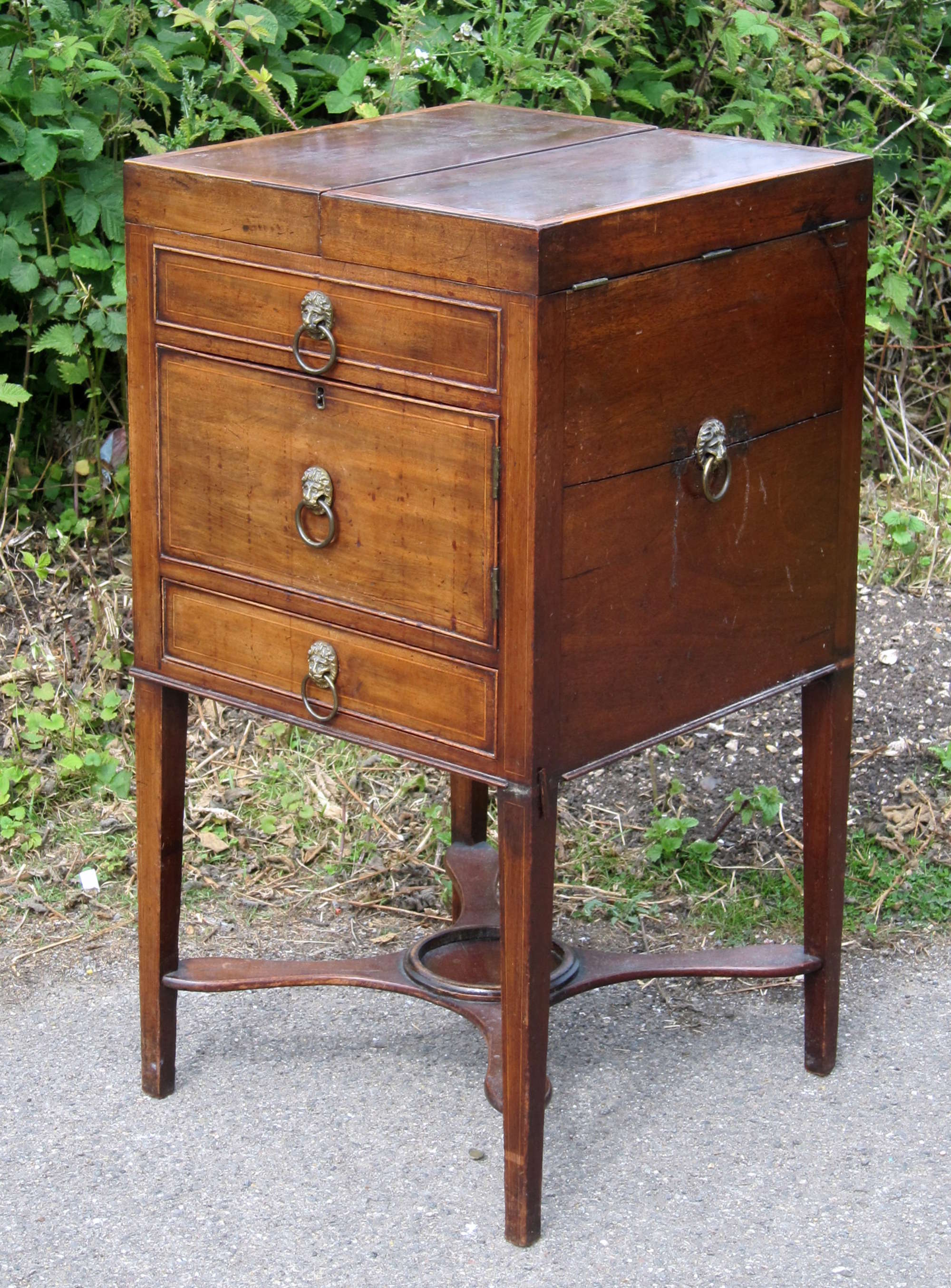 Appraisal: th century mahogany square washstand top with two hinged doors