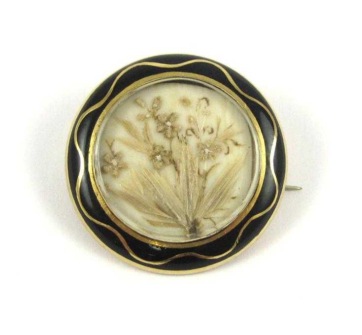 Appraisal: VICTORIAN HAIRWORK MOURNING BROOCH The round k yellow gold brooch