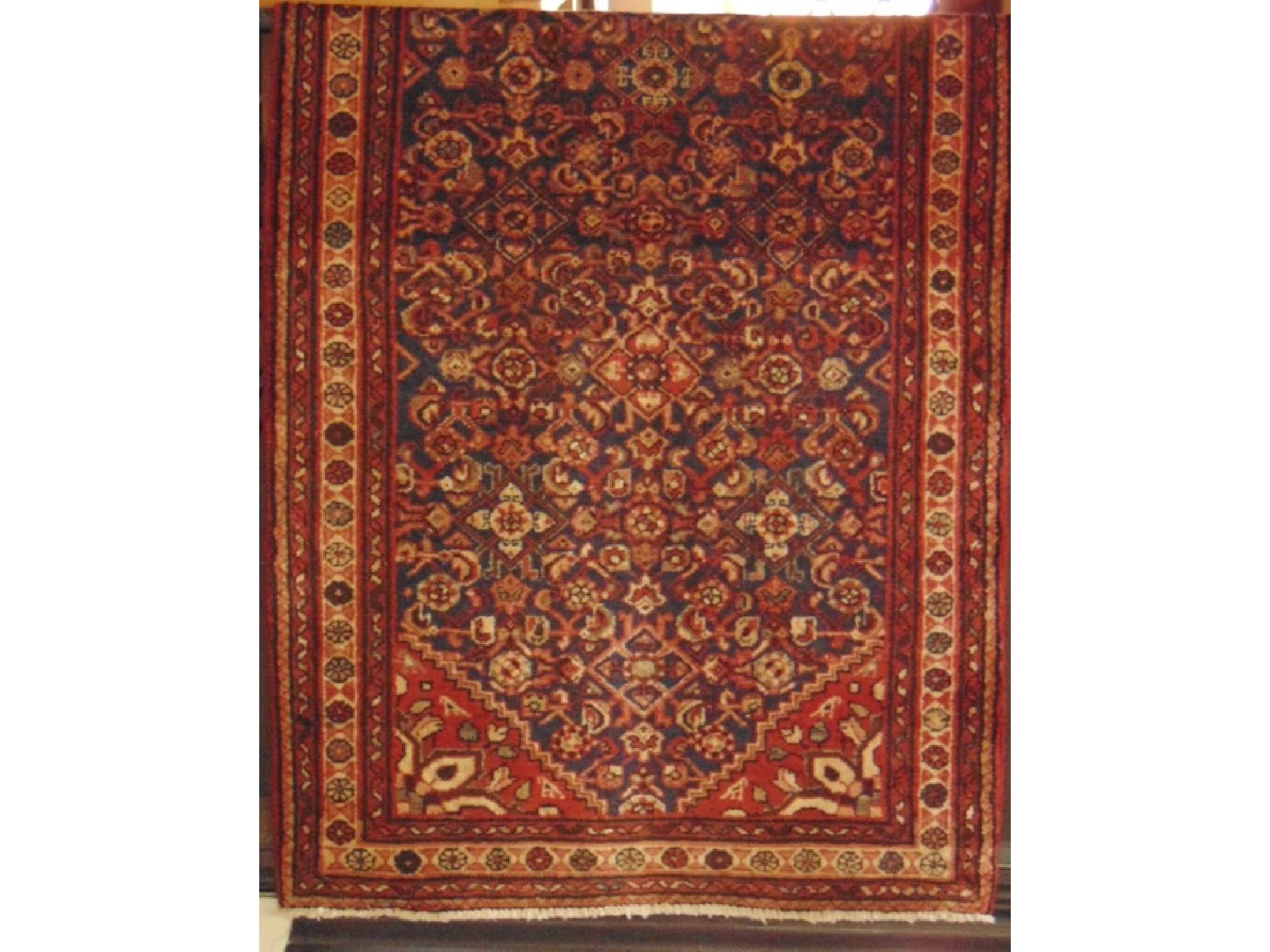 Appraisal: A Persian style wool runner with abstract floral detail upon