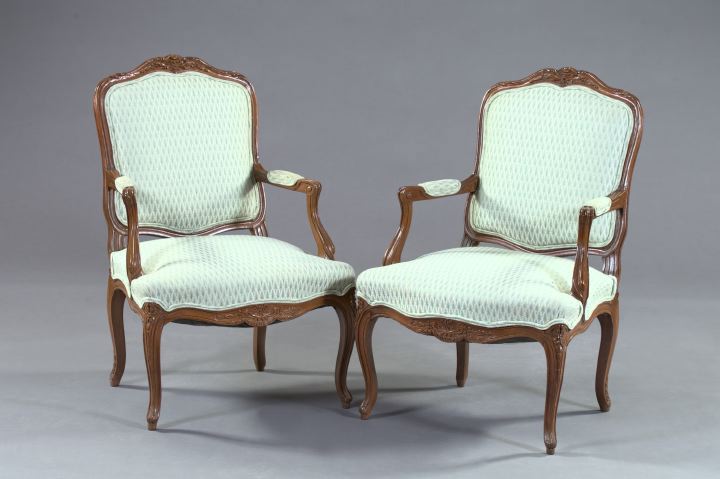 Appraisal: Pair of Louis XV-Style Fruitwood Bergeres the molded frames with