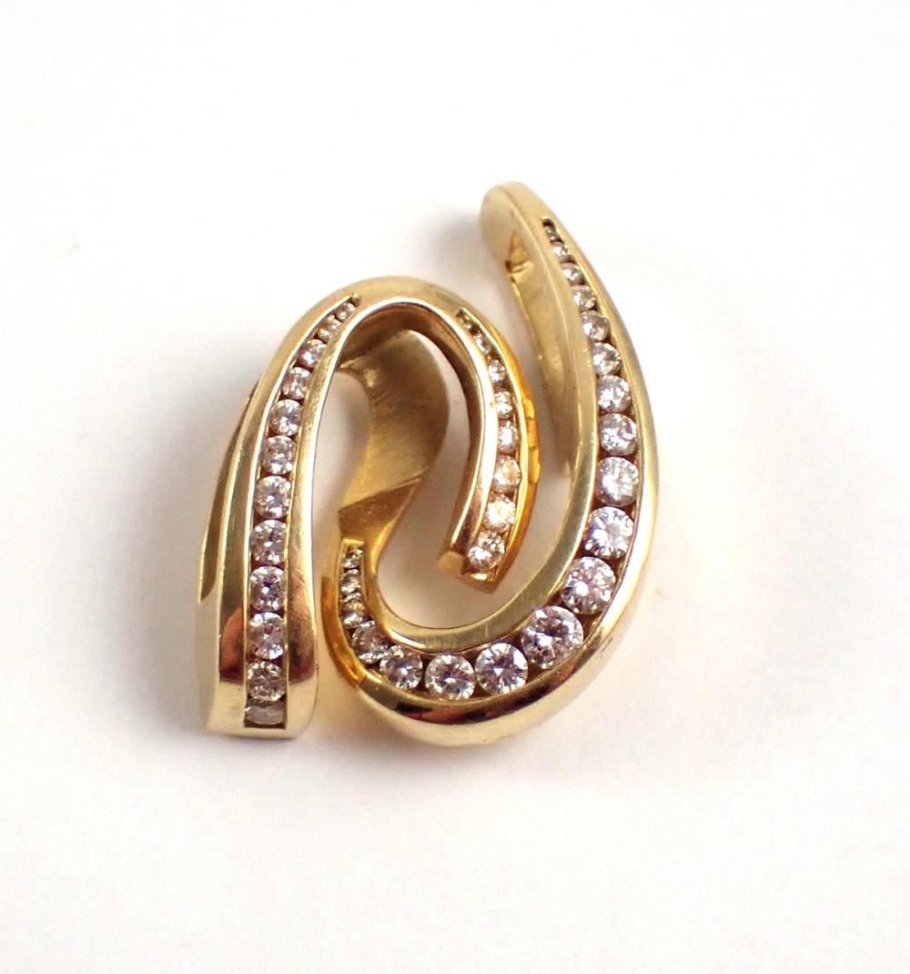 Appraisal: DIAMOND AND FOURTEEN KARAT GOLD SLIDER PENDANT channel set with