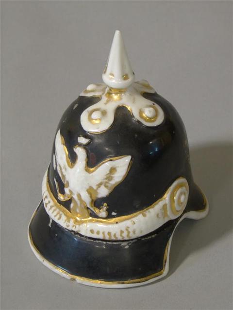 Appraisal: STAFFORDSHIRE FAIRING HELMET INKSTAND As a Prussian helmet enriched in