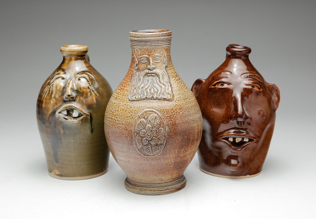 Appraisal: Two American Connor Prairie Indiana grotesque face jugs Brown glazed