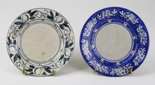 Appraisal: Two Dedham Pottery side plates incl bird in potted orange