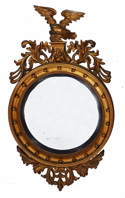 Appraisal: A REGENCY BUTLER'S MIRROR the gilt frame with eagle and