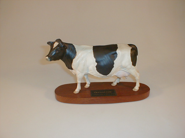 Appraisal: A Beswick connoisseur model of a Friesian cow on a