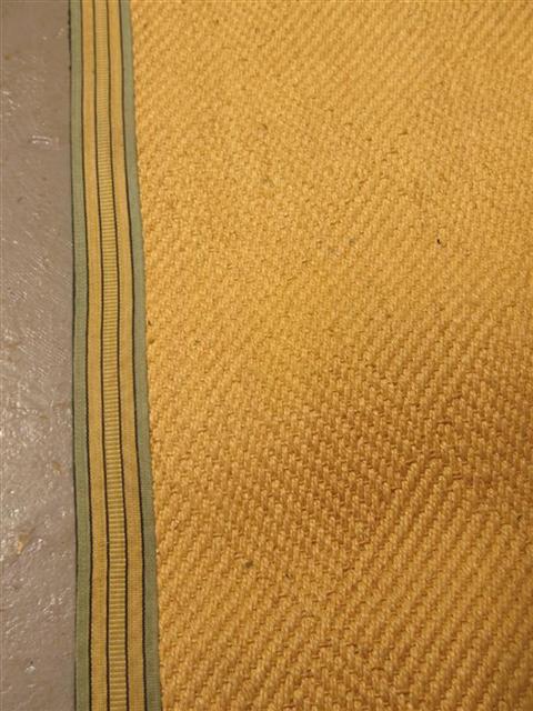 Appraisal: SISAL AREA RUG Together with another area rug