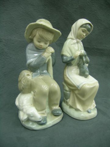 Appraisal: Two Porcelain Zaphis Figurines including girl with rabbit and boy