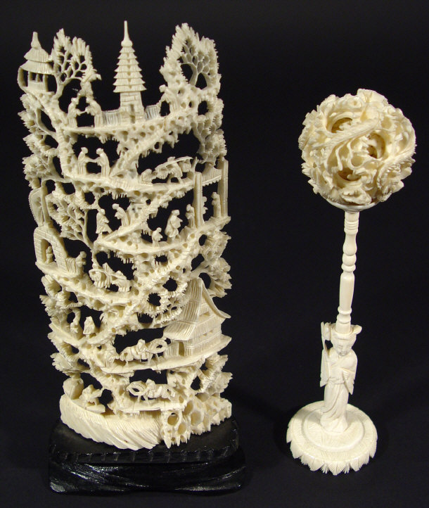 Appraisal: Carved ivory puzzle ball on figural stand together with an