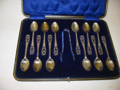 Appraisal: A SET OF TWELVE TEASPOONS AND TONGS maker's mark F