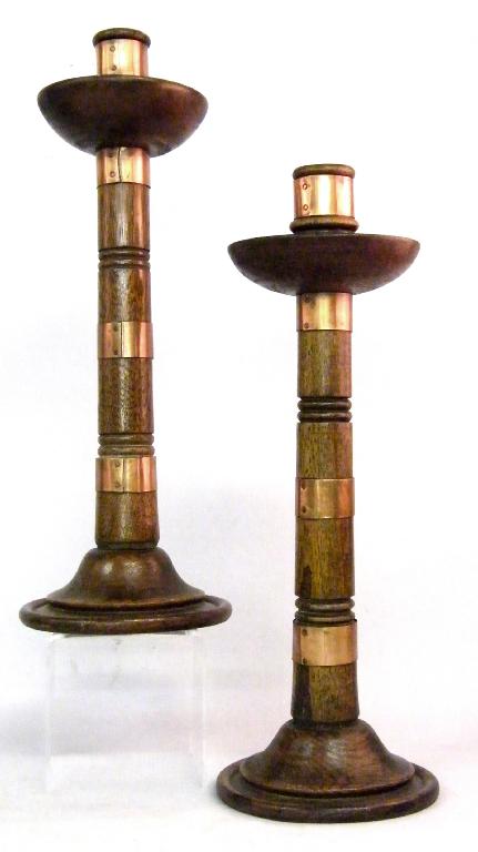 Appraisal: Pair of Arts and Crafts style turned oak candlesticks applied