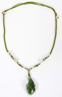 Appraisal: GREEN JADE FLORAL PENDANT ON WOVEN FABRIC NECKLACE GREEN CARVED