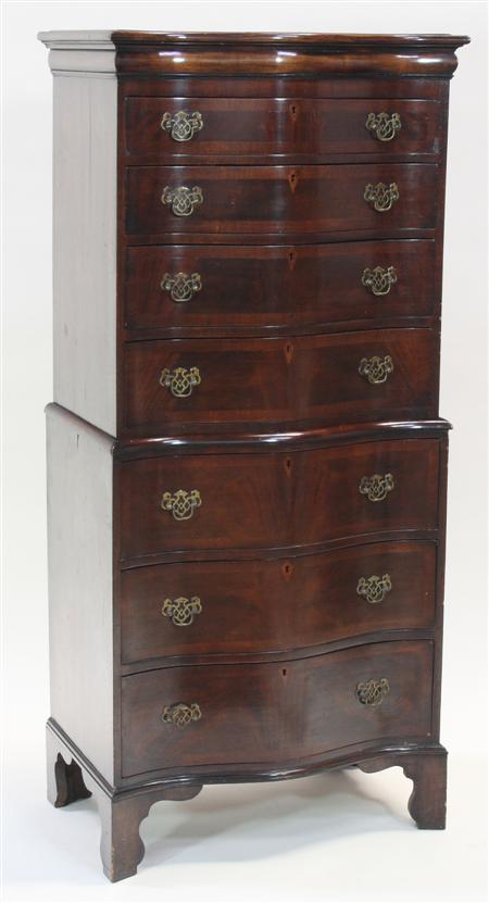 Appraisal: A Georgian style walnut serpentine chest on chest the moulded