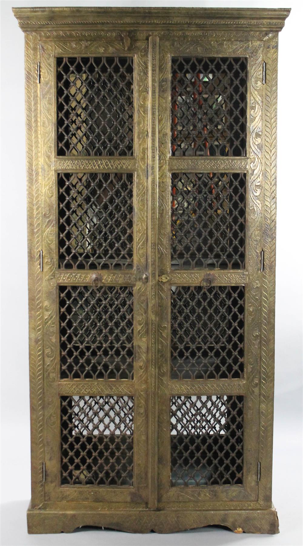 Appraisal: INDIAN SILVERED-METAL VENEERED CABINET the rectangular case covered in a