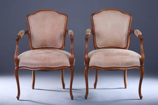 Appraisal: PAIR LOUIS XV STYLE FRUITWOOD FAUTEUILS th Century Tan suede