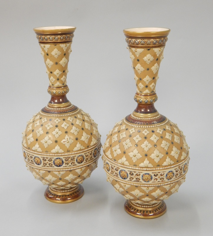 Appraisal: A pair of Mettlach stoneware bottle shaped vases each decorated