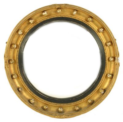 Appraisal: A Victorian giltwood and gesso convex mirror with ebonised reeded