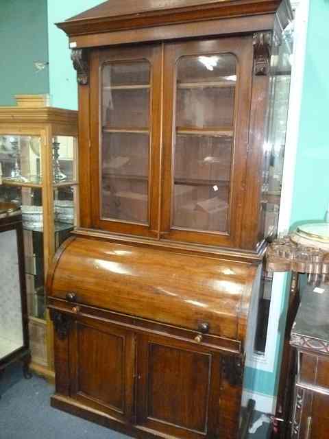 Appraisal: A LIBRARY BUREAU BOOKCASE with pointed pediment over two glazed