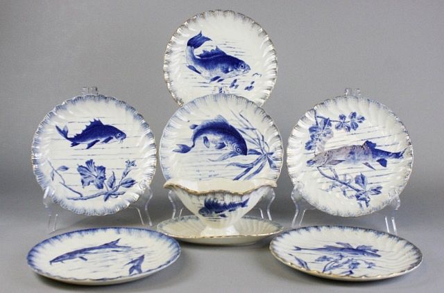 Appraisal: Grouping of Fish Porcelain Plates and Sauce Boat Lot includes