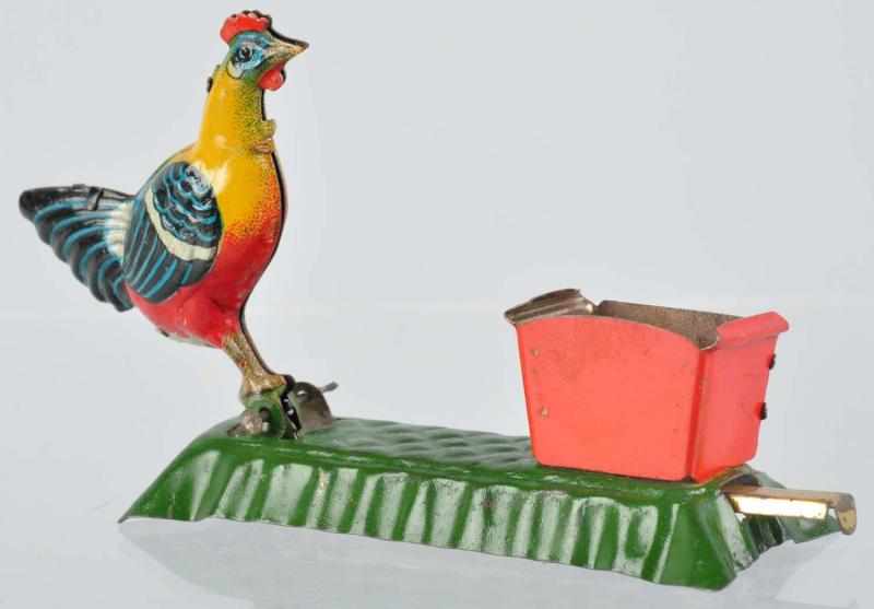 Appraisal: Tin Litho Rooster Pecking Penny Toy German Lever-activated Rooster is