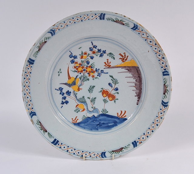 Appraisal: An English Delftware polychrome charger th Centurydecorated in the Chinese