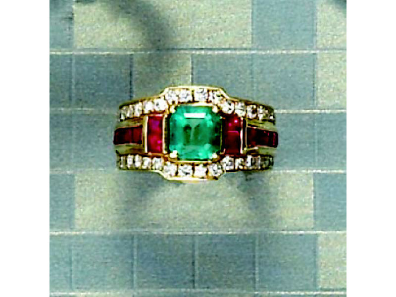 Appraisal: EMERALD RUBY AND DIAMOND RING k yellow gold Emerald cut