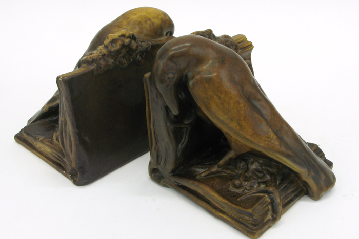 Appraisal: PAIR AMERICAN ROOKWOOD ART POTTERY BOOKENDS figural Rook on an