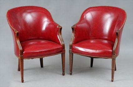 Appraisal: PAIR OF GEORGE III MAHOGANY LEATHER-UPHOLSTERED BARREL-BACK ARMCHAIRS The curved