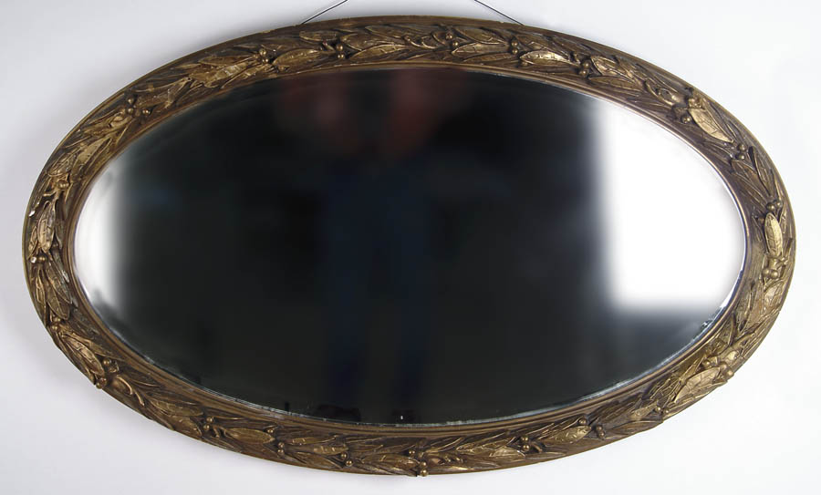 Appraisal: LARGE VICTORIAN OVAL GILT MIRROR The oval frame decorated with