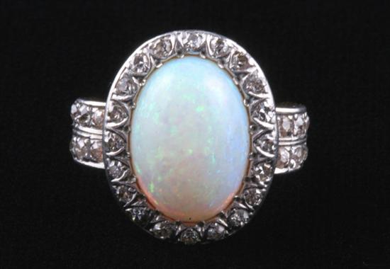 Appraisal: EDWARDIAN PLATINUM-ON-YELLOW GOLD AND PRECIOUS WHITE OPAL RING Oval opal