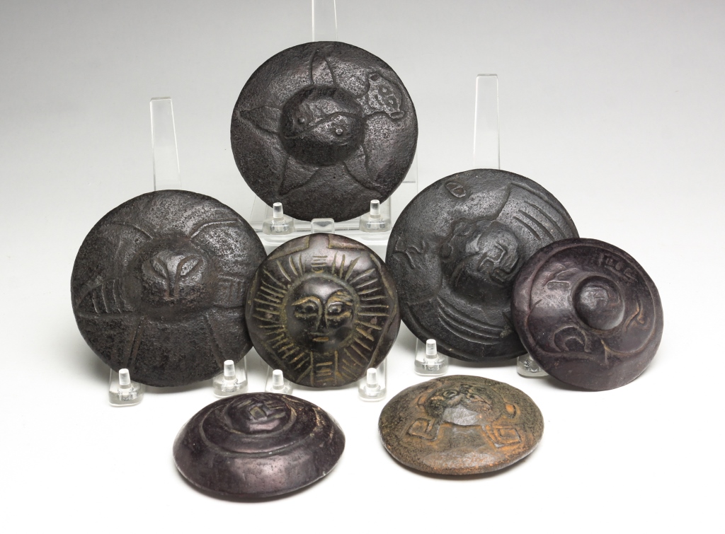 Appraisal: SEVEN ASTROLOGICAL ROUND CARVINGS Twentieth century Round stones with relief