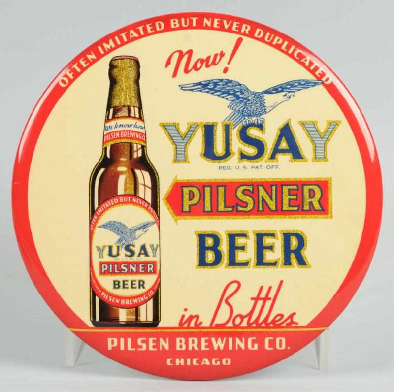 Appraisal: Yusay Pilsner Beer Celluloid Button Sign Very clean example with