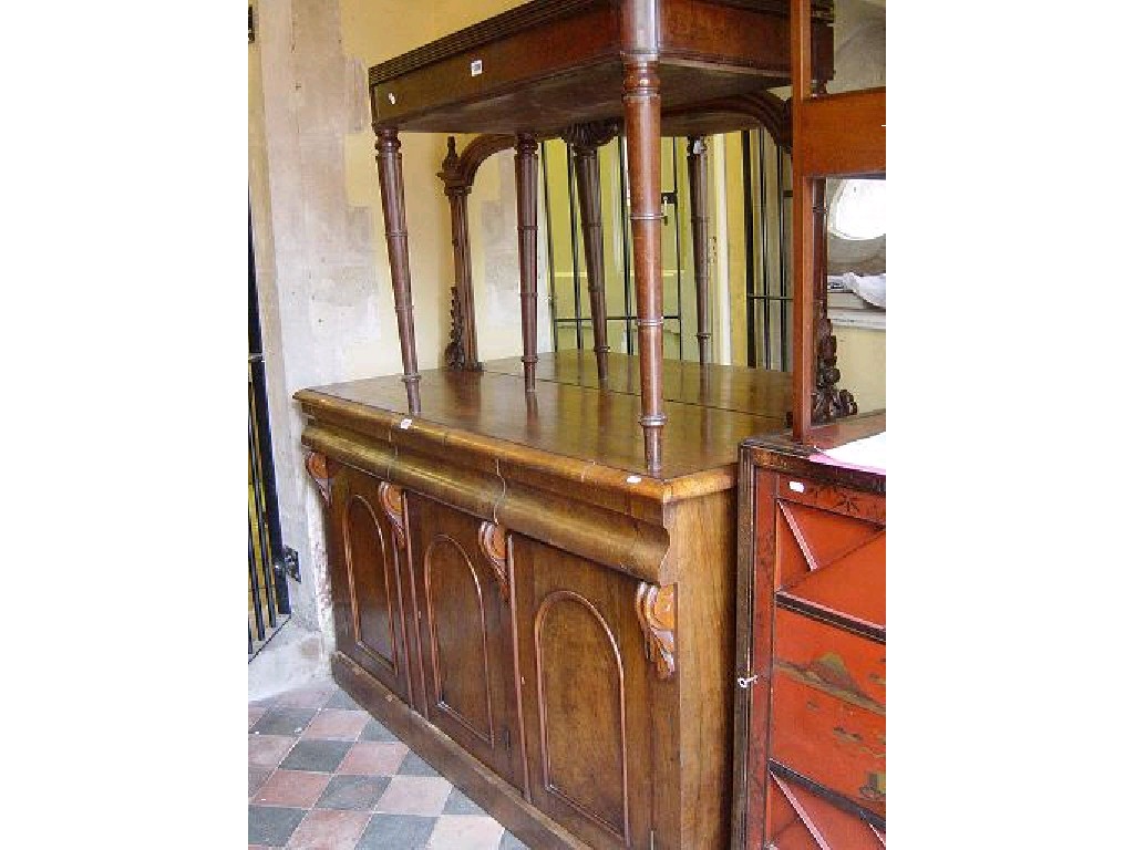 Appraisal: A Victorian walnut and figured walnut sideboard enclosed by three