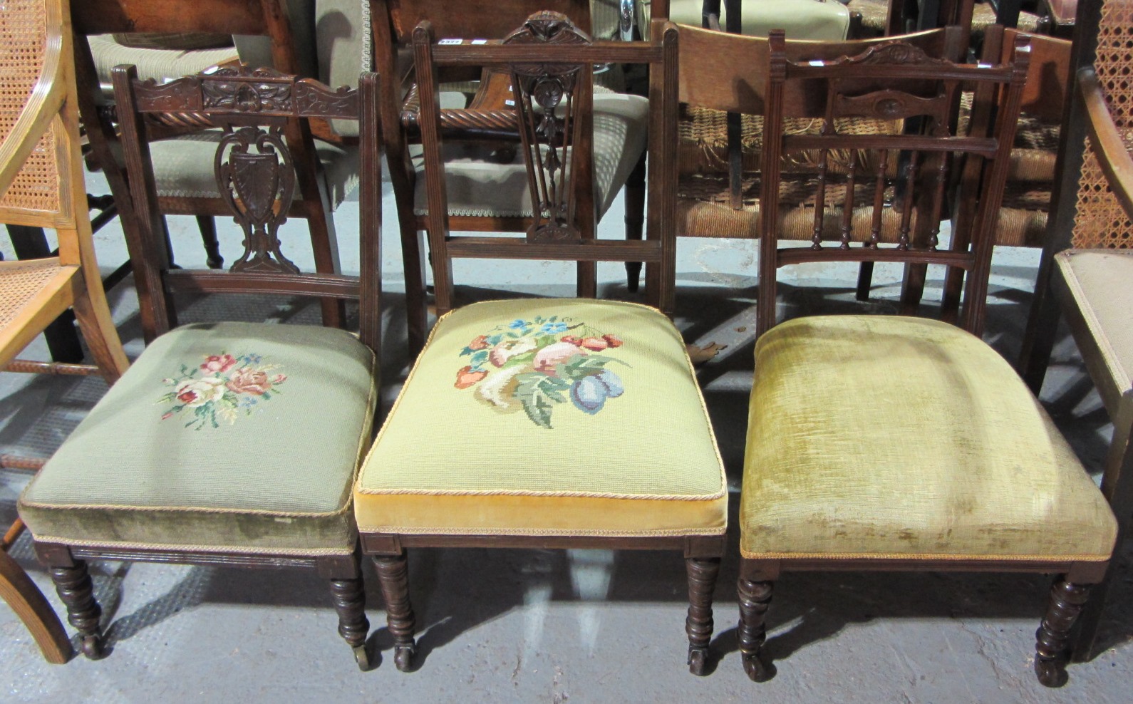 Appraisal: A group of three th century walnut nursing chairs