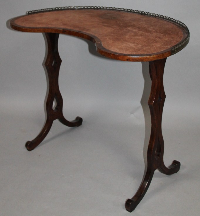 Appraisal: A thC walnut kidney shaped writing desk with a one