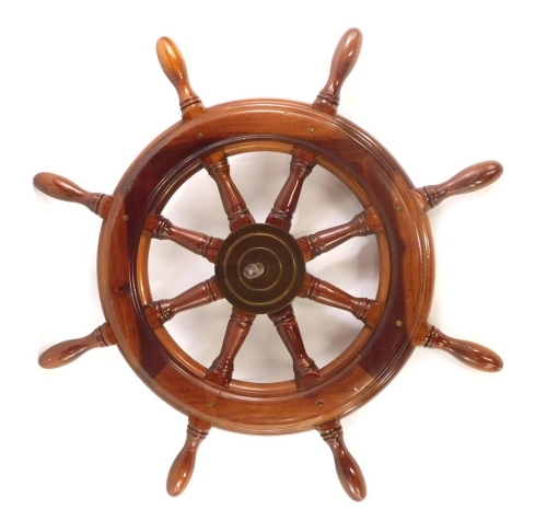 Appraisal: A modern ship's wheel with brass centre cm wide