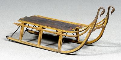 Appraisal: Painted wood and iron gooseneck sled iron mounts with gooseneck