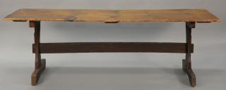 Appraisal: Primitive tressel foot table having pine single board top on