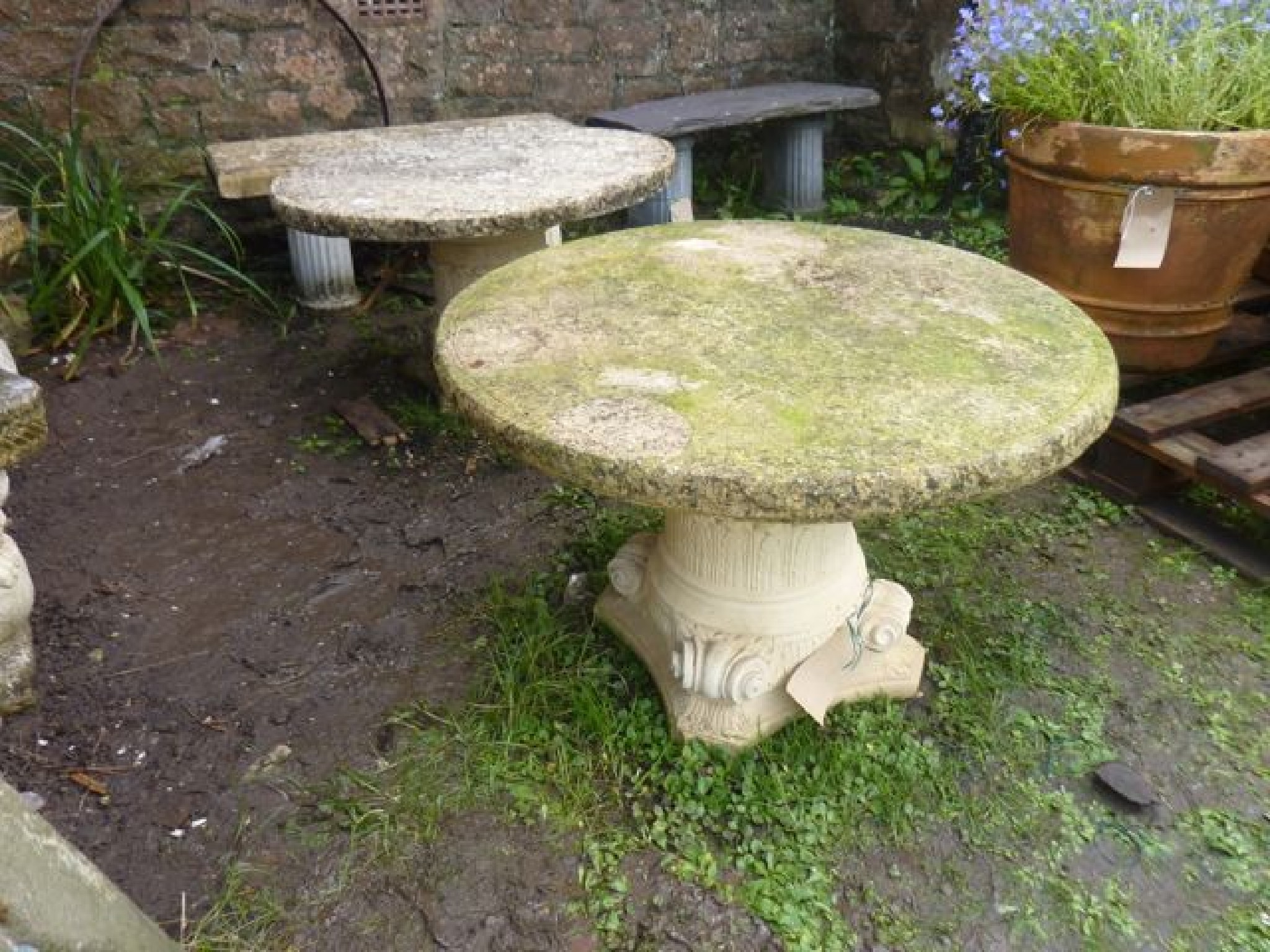 Appraisal: A pair of weathered contemporary cast composition stone low garden