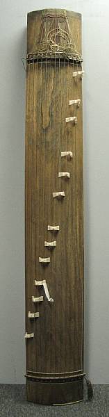 Appraisal: A koto qin Of thirteen-string and supported by a pair