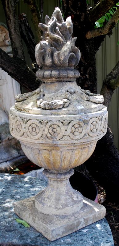 Appraisal: A PAIR OF COMPOSITE STONE URNS WITH FLAME FINIALS the