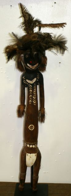 Appraisal: A carved Papuan male figure carved and decorated with ochre