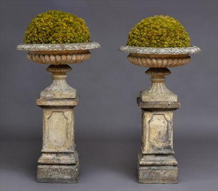 Appraisal: PAIR OF NEOCLASSICAL FIRED CLAY URNS ON STONE BASESEach campani-form