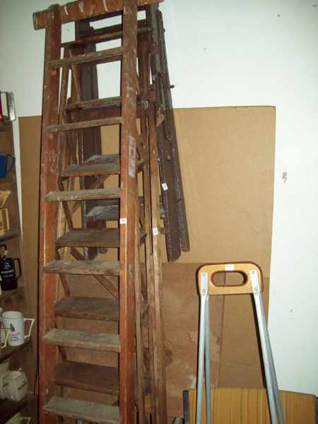 Appraisal: THREE ANTIQUE WOODEN LADDERS AND A DRAFTSMAN'S BOARD ONE CHAIR