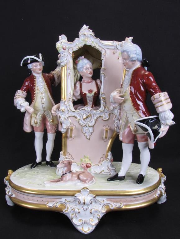 Appraisal: A Royal Dux porcelain figural grouping depicting a sedan with