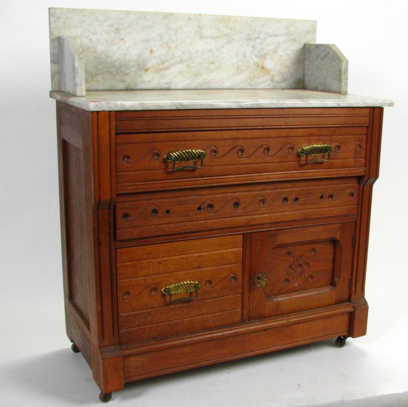 Appraisal: Late Victorian Walnut Wash Stand three drawers and one door